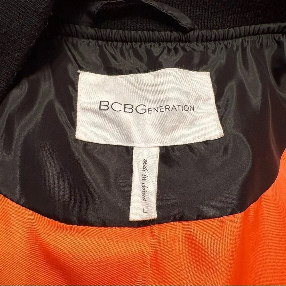 BCBGeneration Black Quilted Jacket with Vibrant Orange Lining Size large